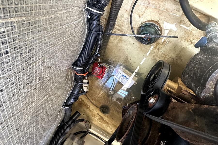 Engine compartment of 2013 Chris-Craft Corsair 22 with visible wiring and components.