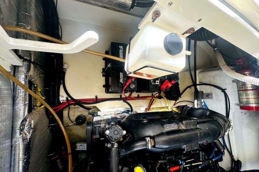 Engine compartment of a 2013 Chris-Craft Corsair 22 boat, showing wiring and components.