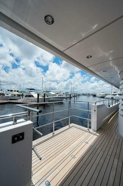 Luxury yacht Majesty 140, 2020 model, docked at marina under blue sky.