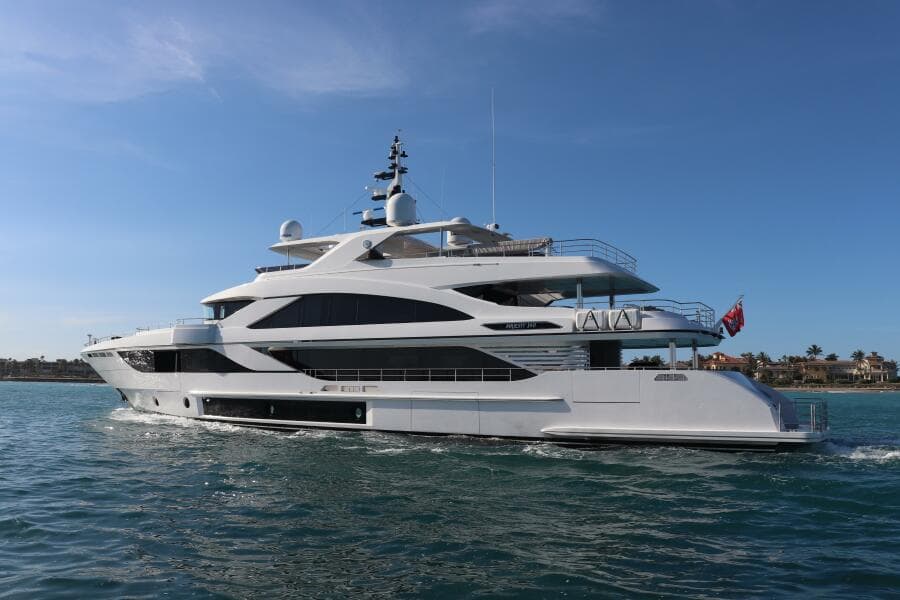 Luxurious 2020 Majesty 140 yacht cruising on clear blue waters.