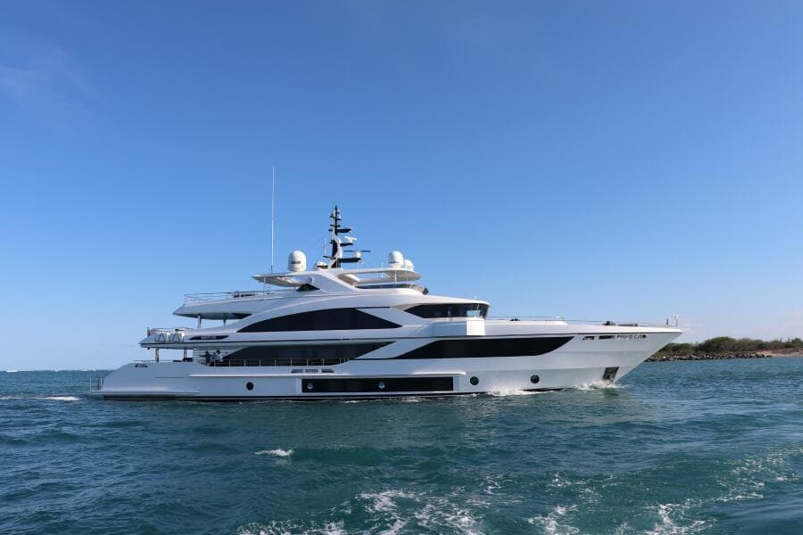 Luxury Majesty 140 yacht cruising on open sea, 2020 model, under clear blue sky.