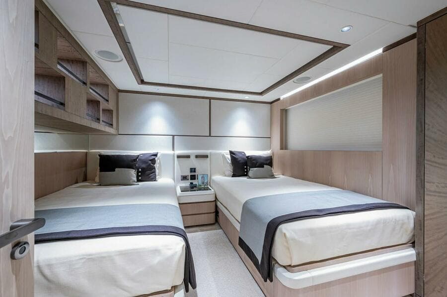 Luxurious twin bedroom in 2020 Majesty 140 yacht, featuring modern design and elegant decor.