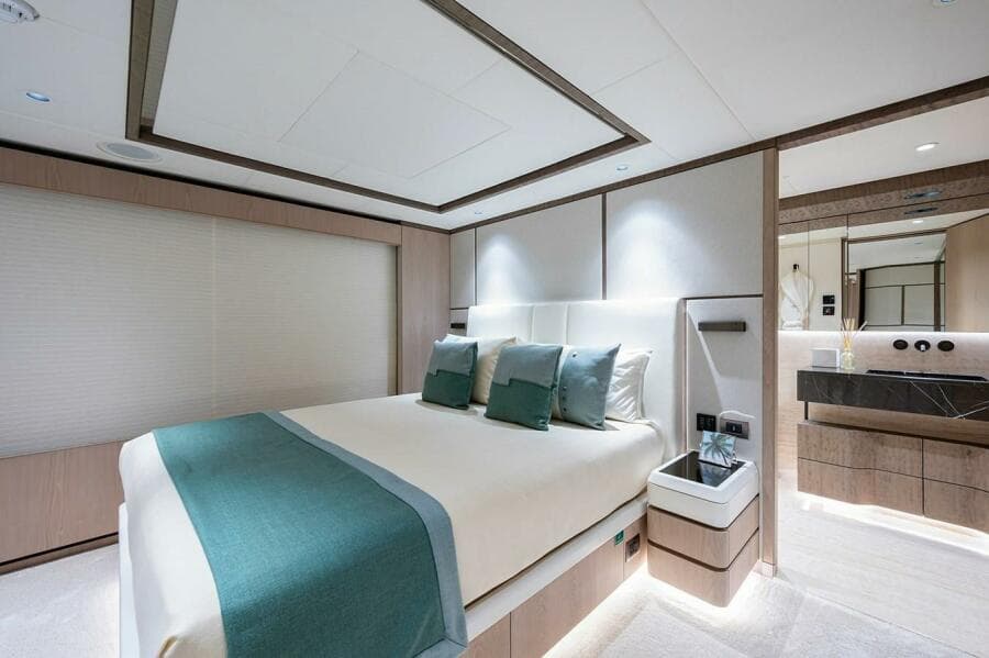Luxurious bedroom interior of 2020 Majesty 140 yacht with modern design and elegant decor.
