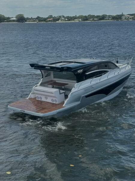 2025 Real 40 HT Luxury yacht cruising on a serene lake.