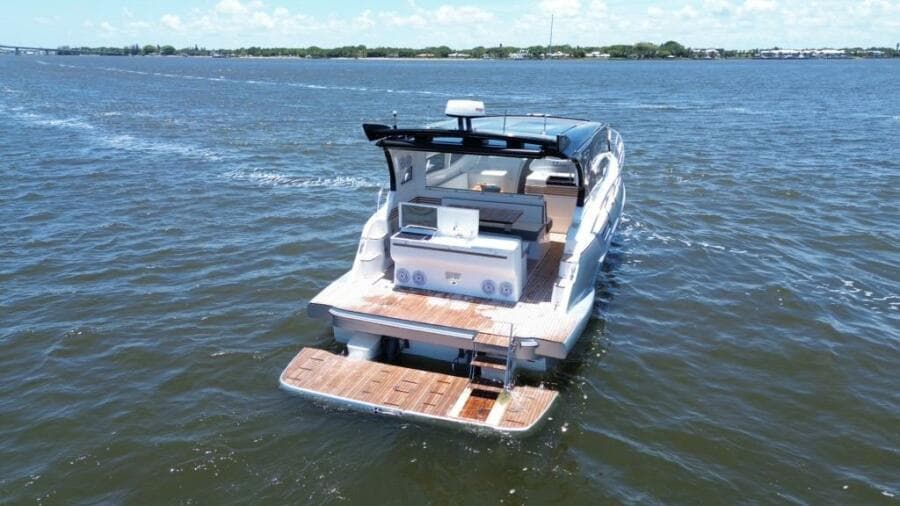 Luxury yacht "Real 40 HT" cruising on open water, 2025 model.