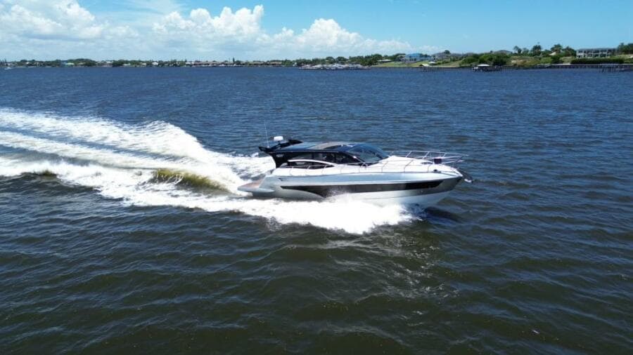 Luxury yacht Real 40 HT 2025 cruising on open water under clear skies.