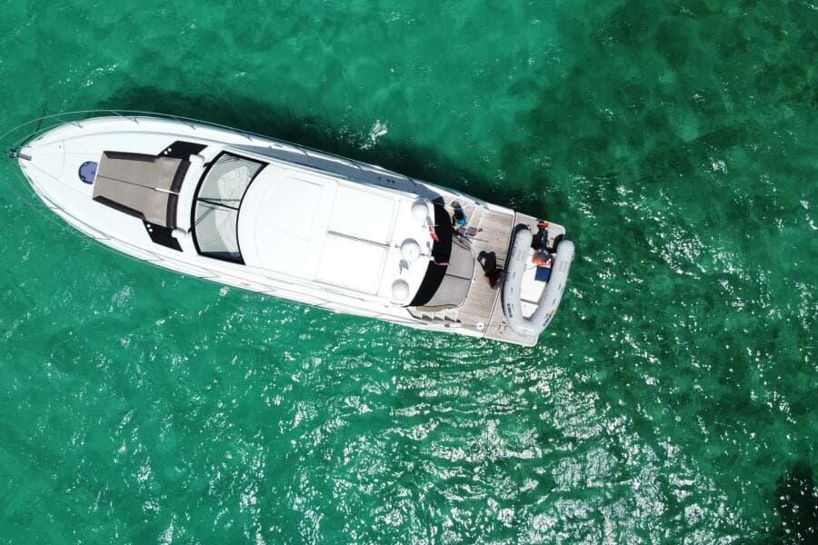 Aerial view of 2014 Beneteau Gran Turismo 44 yacht on turquoise water.
