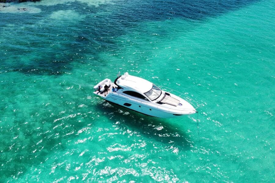 2014 Beneteau Gran Turismo 44 yacht cruising in clear turquoise waters.