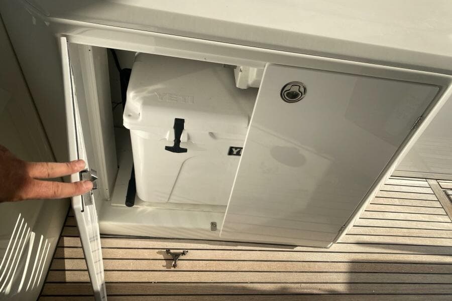 Storage compartment on 2014 Beneteau Gran Turismo 44 with Yeti cooler inside.
