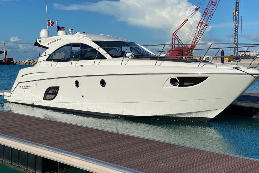 2014 Beneteau Gran Turismo 44 yacht docked at marina, clear sky background.
