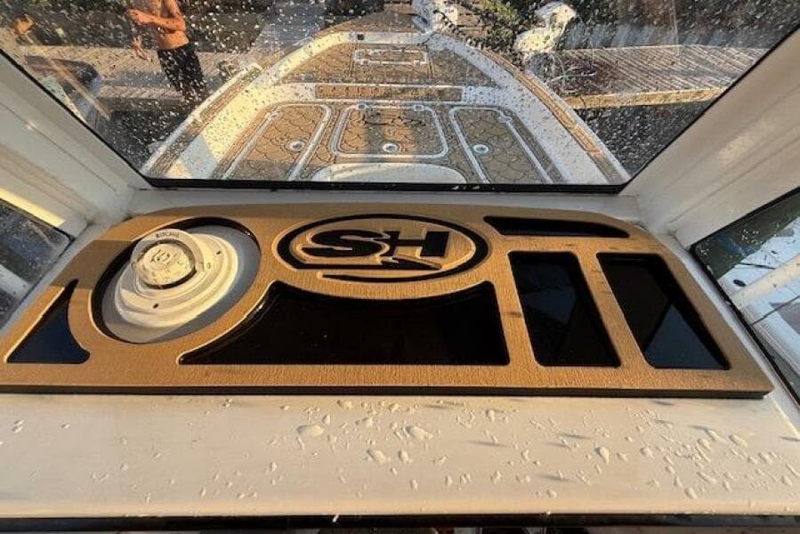 2018 Sea Hunt BX 25 FS boat dashboard with SH logo and water droplets.