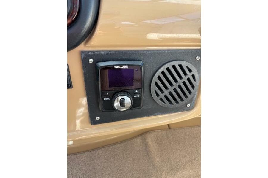 Control panel on 2004 Carver 466 Motor Yacht with Zipwake system and speaker grille.