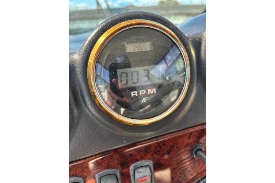 Close-up of 2004 Carver 466 Motor Yacht RPM gauge displaying 1465.