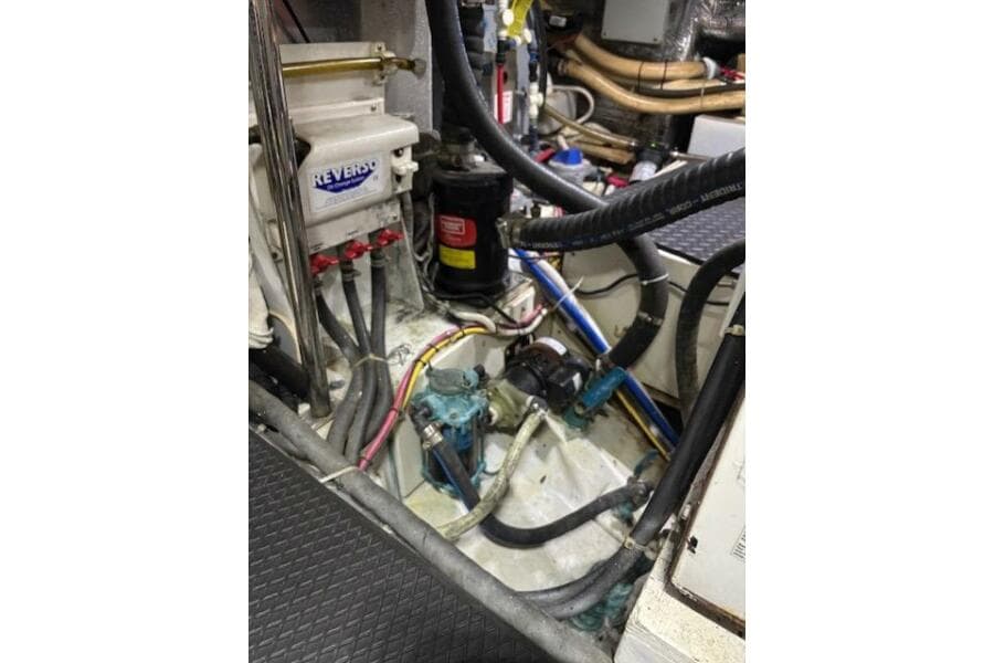 Engine room of 2004 Carver 466 Motor Yacht with various mechanical components.