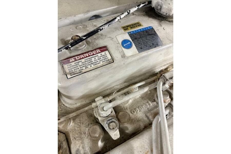 Engine compartment of 2004 Carver 466 Motor Yacht with warning labels.