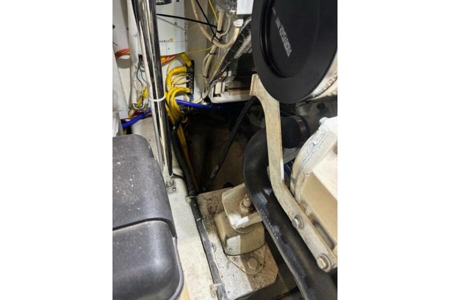 Engine room of a 2004 Carver 466 Motor Yacht, showing mechanical components and wiring.