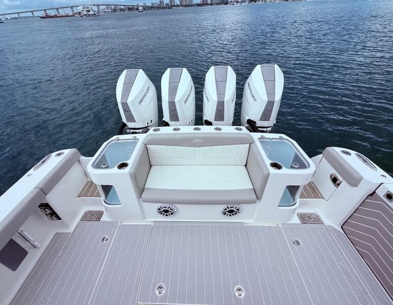 2024 Scout 400 LXF boat with four Mercury engines on the water.