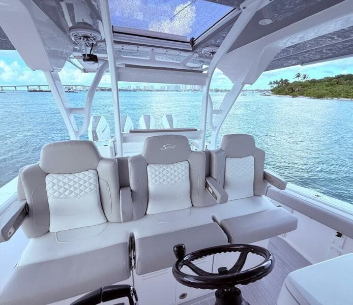 2024 Scout 400 LXF boat interior with luxurious seating and ocean view.