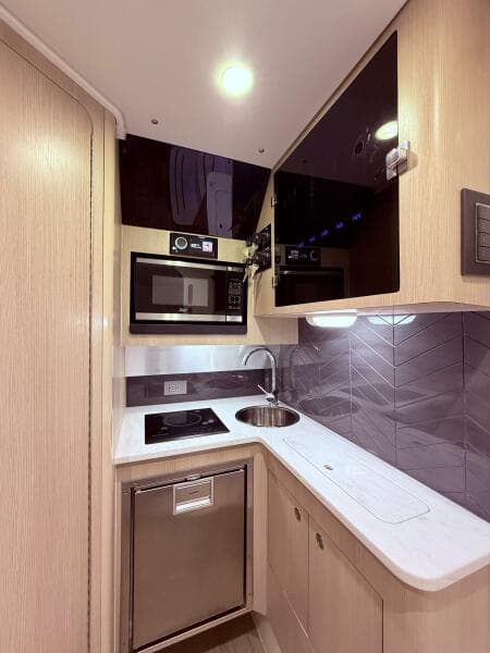 2024 Scout 400 LXF yacht kitchen with modern appliances and sleek design.