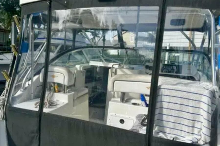 2002 Wellcraft 290 Coastal boat interior with seating and dashboard view.