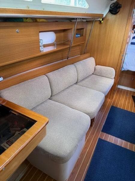 Side settee in salon which is a berth when bolsters removed
