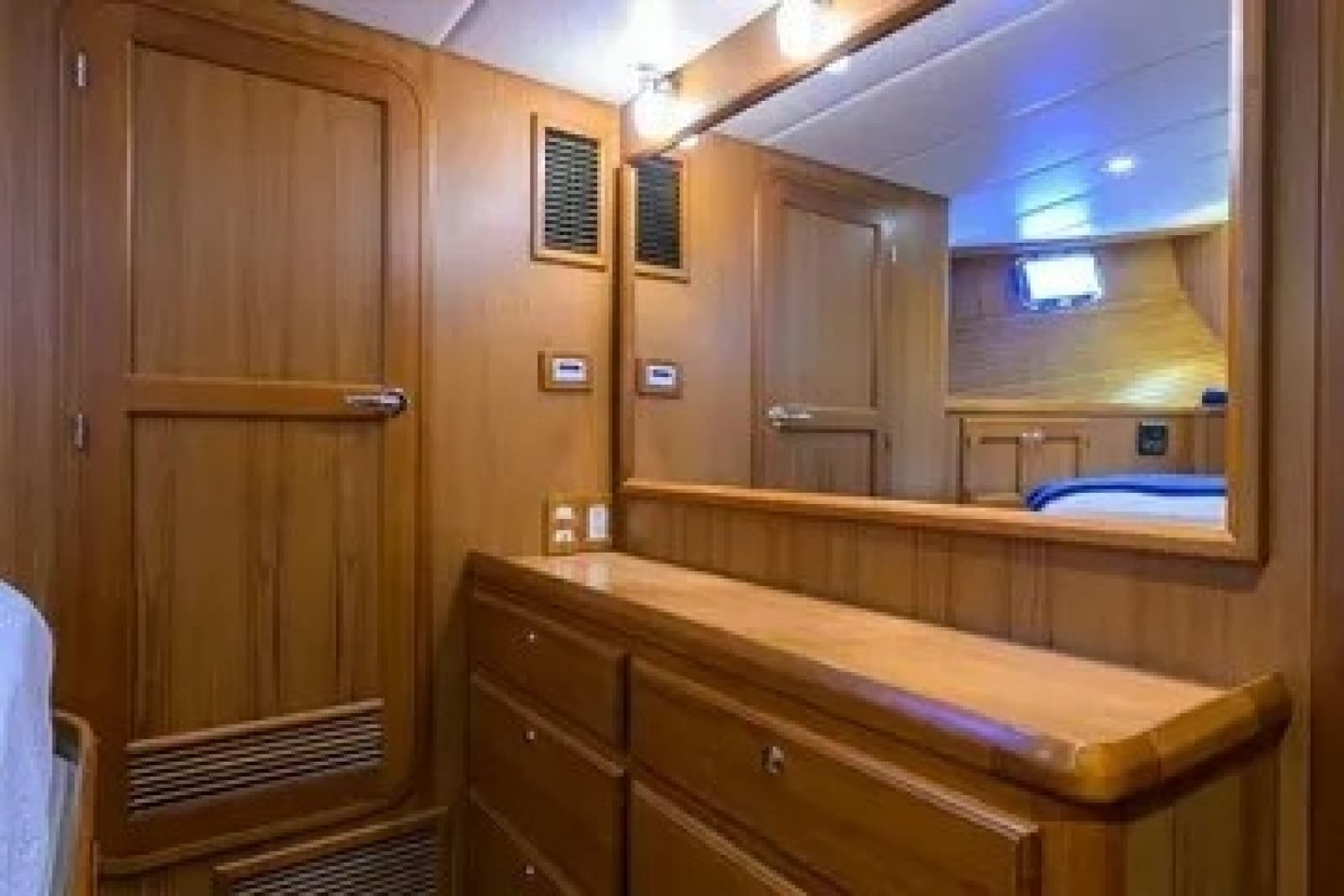 Large closet and bureau with lighted mirror