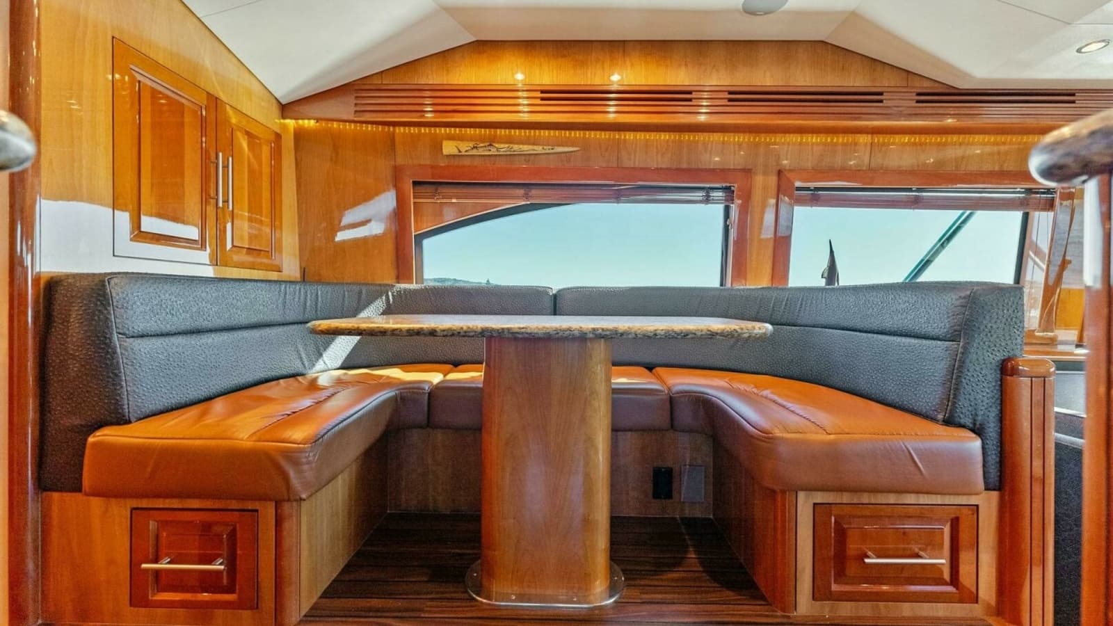 2007 Hatteras 64 Convertible CHUPACABRA - Cozy Dinette Featuring Leather Seating and Granite Table.