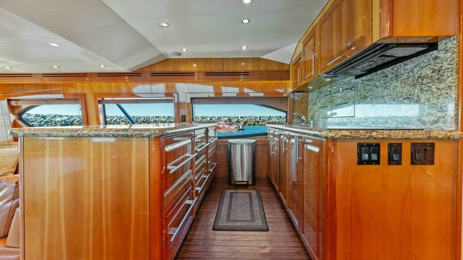 2007 Hatteras 64 Convertible CHUPACABRA - Galley with Granite Countertops and Rich Wood Cabinetry.
