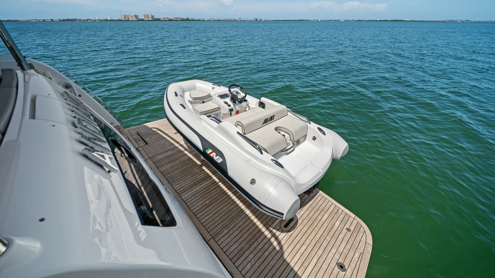 2026 Absolute Navetta 58 "ANDIAMO" - Teak-Finished Swim Platform and Tender Storage.