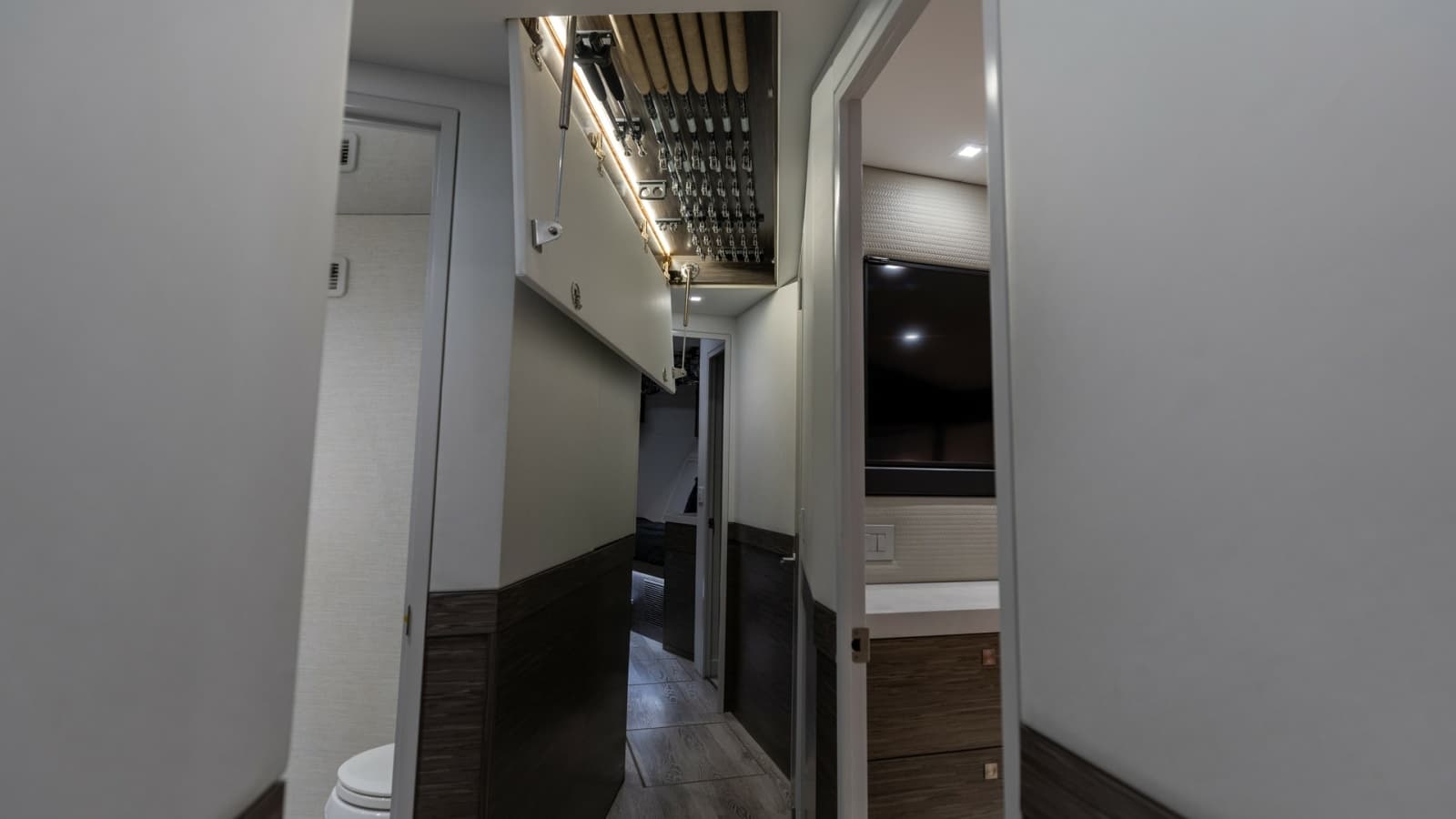 2021 65 Hatteras GT On the DL Companionway with Concealed overhead Rod Storage