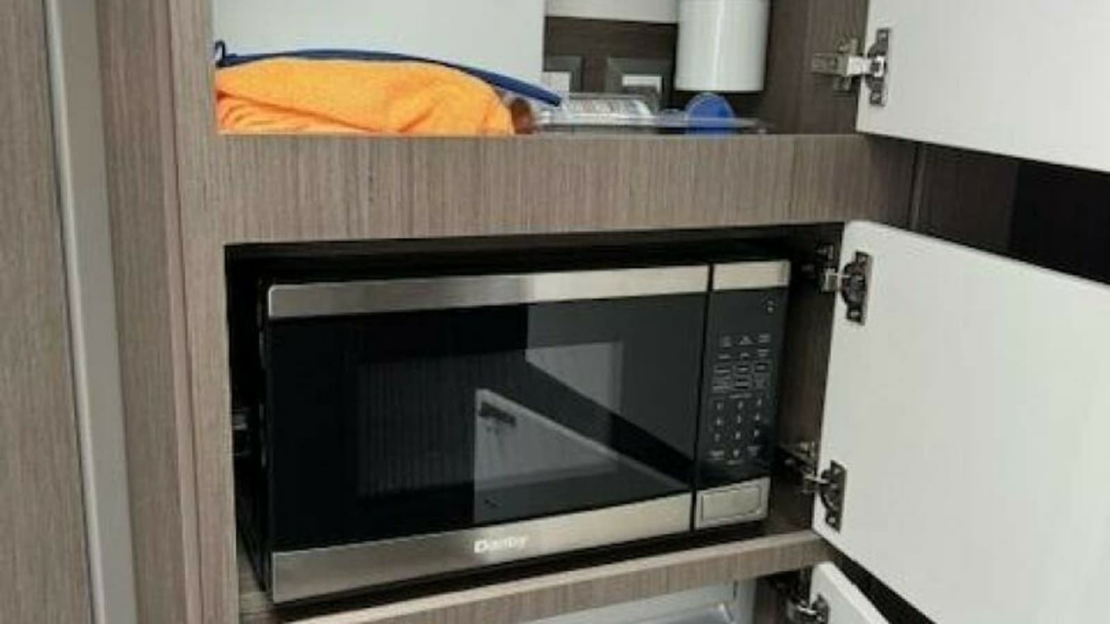 2022 Beneteau 32 Gran Turismo "FORTUNA" - Galley Microwave and Storage Cabinetry
